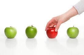 Epic Clarity Consultant Person touching the red apple | Epic Clarity Consultant