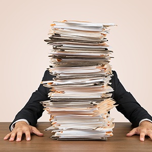 A pile of documents on top of the table